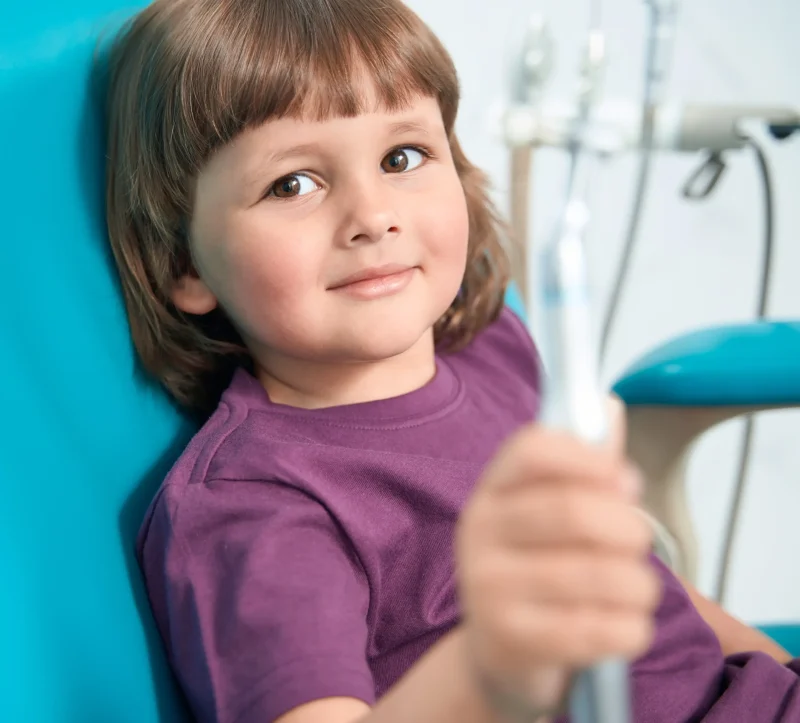 Calm child in dental chair at Germantown Pediatric Dental Center — complex medical conditions care